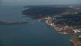 5K aerial stock footage of Hempstead Harbor and a power plant with smoke stacks on the shore in Glenwood Landing, Long Island, New York, winter Aerial Stock Footage | AX0065_0024E