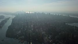 5K aerial stock footage of a view of Midtown Manhattan seen from the Upper East Side, New York City, winter Aerial Stock Footage | AX0065_0043