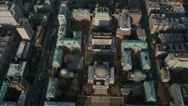 5K aerial stock footage tilt to a bird's eye view of Low Memorial Library on the Columbia University campus in New York City, winter Aerial Stock Footage | AX0065_0049E