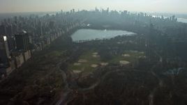 5K aerial stock footage fly over Central Park to approach baseball fields and the reservoir, New York City, winter Aerial Stock Footage | AX0065_0054