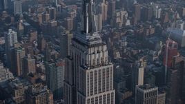 5K aerial stock footage the top of the Empire State Building in Midtown Manhattan, New York City, winter Aerial Stock Footage | AX0065_0063