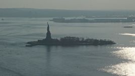 5K aerial stock footage approach the Statue of Liberty, New York, winter Aerial Stock Footage | AX0065_0074