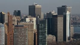 5K aerial stock footage of flying by skyscrapers in Lower Manhattan, New York City, winter, revealing Brooklyn skyscrapers across the East River Aerial Stock Footage | AX0065_0096