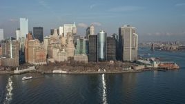 5K aerial stock footage of flying by Battery Park and the Lower Manhattan skyline, New York City, winter Aerial Stock Footage | AX0065_0097E