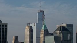 5K aerial stock footage of the top of Freedom Tower seen from the East River, Lower Manhattan, New York City, winter Aerial Stock Footage | AX0065_0102