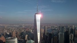 5K aerial stock footage of an orbit of Freedom Tower with the sun reflecting off the building in Lower Manhattan, New York City, winter Aerial Stock Footage | AX0065_0114