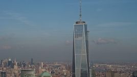 5K aerial stock footage tilt up to the spire atop Freedom Tower in Lower Manhattan, New York City, winter Aerial Stock Footage | AX0065_0115
