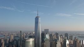 5K aerial stock footage approach and flyby One World Trade Center and Lower Manhattan skyscrapers from the Hudson River, New York City, winter Aerial Stock Footage | AX0065_0135E
