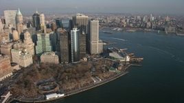 5K aerial stock footage of Lower Manhattan skyscrapers and Battery Park in winter, New York City, winter Aerial Stock Footage | AX0065_0137E