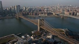 5K aerial stock footage follow Brooklyn Queens Expressway to approach and pass the Brooklyn Bridge, New York City, winter Aerial Stock Footage | AX0065_0142E