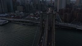 5K aerial stock footage of tracking the Brooklyn Bridge with heavy traffic, New York City, winter, twilight Aerial Stock Footage | AX0065_0179