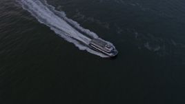 5K aerial stock footage track a NY Waterways ferry sailing New York Harbor, winter, twilight Aerial Stock Footage | AX0065_0182