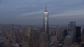5K aerial stock footage an orbit of Freedom Tower in Lower Manhattan with Hudson River and Midtown in the background, New York City, winter, sunset Aerial Stock Footage | AX0065_0204E