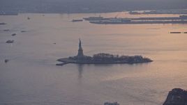 5K aerial stock footage of Statue of Liberty and Liberty Island in New York, winter, twilight Aerial Stock Footage | AX0065_0212