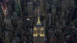 5K aerial stock footage approach the Empire State Building in Midtown Manhattan, New York City, winter, twilight Aerial Stock Footage | AX0065_0235E