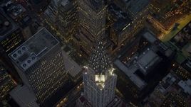 5K aerial stock footage tilt to a bird's eye view of the Chrysler Building in Midtown Manhattan, New York City, winter, twilight Aerial Stock Footage | AX0065_0241