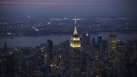 5K aerial stock footage slow approach and flyby the Empire State Building in Midtown Manhattan, New York City, winter, twilight Aerial Stock Footage | AX0065_0249E