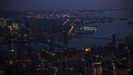 5K aerial stock footage of Manhattan and Brooklyn Bridges spanning East River, Brooklyn in the background, New York City, winter, twilight Aerial Stock Footage | AX0065_0262E
