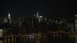 5K aerial stock footage approach the Chrysler Building and Midtown Manhattan skyscrapers, New York City, winter, night Aerial Stock Footage | AX0065_0305