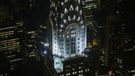 5K aerial stock footage orbit the side of the Chrysler Building in Midtown Manhattan, New York City, winter, night Aerial Stock Footage | AX0065_0316E