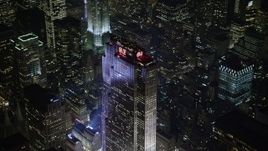 5K aerial stock footage of flying away from Rockefeller Center in Midtown Manhattan, New York City, winter, night Aerial Stock Footage | AX0065_0339