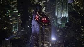 5K aerial stock footage of tracking top of Rockefeller Center skyscraper in Midtown Manhattan, New York City, winter, night Aerial Stock Footage | AX0065_0340