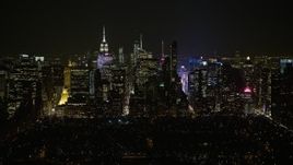 5K aerial stock footage of Midtown Manhattan seen from Central Park, New York City, winter, night Aerial Stock Footage | AX0065_0344E