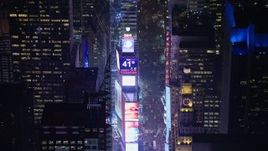 5K aerial stock footage approach the large screens and 2014 New Years ball at Times Square, New York City, winter, night Aerial Stock Footage | AX0065_0346