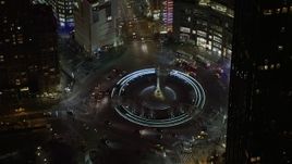5K aerial stock footage of police vehicles and light traffic on Columbus Circle in Midtown Manhattan, New York City, winter, night Aerial Stock Footage | AX0065_0347E