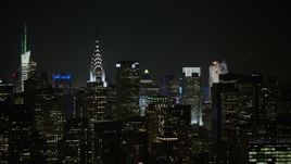 5K aerial stock footage flyby the Chrysler Building and Midtown Manhattan skyscrapers, New York City, winter, night Aerial Stock Footage | AX0065_0363E