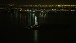 5K aerial stock footage of the Statue of Liberty and Liberty Island in New York, winter, night Aerial Stock Footage | AX0065_0382E