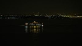 5K aerial stock footage of Staten Island Ferry sailing New York Harbor, winter, night Aerial Stock Footage | AX0065_0385