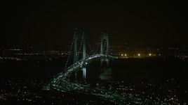 5K aerial stock footage of passing by the Verrazano-Narrows Bridge in New York City, winter, night Aerial Stock Footage | AX0065_0399E