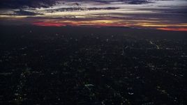7.6K aerial stock footage flying over the city to approach Downtown Los Angeles skyscrapers at sunrise, California Aerial Stock Footage | AX0156_032