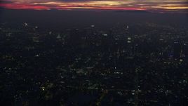 7.6K aerial stock footage approaching Downtown Los Angeles skyscrapers at sunrise, California Aerial Stock Footage | AX0156_033