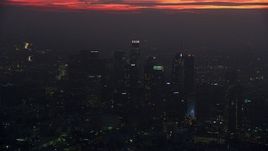7.6K aerial stock footage of a reverse view of tall skyscrapers in Downtown Los Angeles at sunrise, California Aerial Stock Footage | AX0156_039