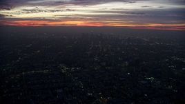 7.6K aerial stock footage flying by and away from Downtown Los Angeles at sunrise, California Aerial Stock Footage | AX0156_040