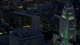 7.6K aerial stock footage of LAPD Headquarters, LA Times Building, and City Hall in Downtown Los Angeles at sunrise, California Aerial Stock Footage | AX0156_047