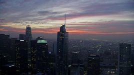 7.6K aerial stock footage flying by Downtown Los Angeles skyscrapers and Wilshire Grand Center at sunrise, California Aerial Stock Footage | AX0156_048E