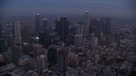 7.6K aerial stock footage of the towering skyscrapers of Downtown Los Angeles, California as the sun rises Aerial Stock Footage | AX0156_066E