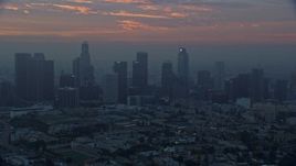 7.6K aerial stock footage of a reverse view of the Downtown Los Angeles, California skyline in the morning Aerial Stock Footage | AX0156_080