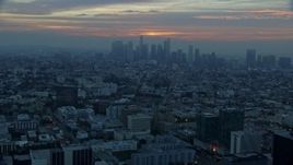 7.6K aerial stock footage approaching the Downtown Los Angeles, California skyline on a hazy morning Aerial Stock Footage | AX0156_082E