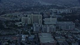 7.6K aerial stock footage orbiting General Hospital at USC Health Sciences Campus in Boyle Heights, Los Angeles, California at sunrise Aerial Stock Footage | AX0156_093E