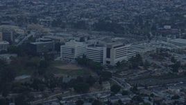 7.6K aerial stock footage of Keck Hospital at the Health Sciences Campus in Boyle Heights, Los Angeles, California at sunrise Aerial Stock Footage | AX0156_100