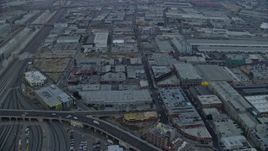 7.6K aerial stock footage of warehouse buildings in the Arts District of Downtown Los Angeles, California at sunrise Aerial Stock Footage | AX0156_102E