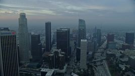 7.6K aerial stock footage of US Bank Tower and skyscrapers in Downtown Los Angeles, California at sunrise Aerial Stock Footage | AX0156_105E