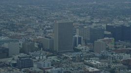 7.6K aerial stock footage of office buildings and the Equitable Life Building in Koreatown, Los Angeles, California at sunrise Aerial Stock Footage | AX0156_107E