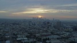 7.6K aerial stock footage approaching Koreatown office buildings and the skyline of Downtown Los Angeles, California at sunrise Aerial Stock Footage | AX0156_109