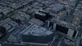 7.6K aerial stock footage flying over mansions to approach Beverly Center and Cedars-Sinai Medical Center at sunrise in Beverly Hills, California Aerial Stock Footage | AX0156_121
