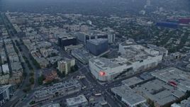 7.6K aerial stock footage orbit of Beverly Center and Cedars-Sinai Medical Center at sunrise, Beverly Hills, California Aerial Stock Footage | AX0156_122E